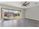 Living room with sliding doors to backyard and neutral colors at 10709 E Thornton Ave, Mesa, AZ 85212