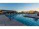 Large community pool area with multiple shade structures at 10709 E Thornton Ave, Mesa, AZ 85212