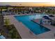 Community lap pool with surrounding lounge chairs at 10709 E Thornton Ave, Mesa, AZ 85212