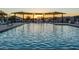 Community pool with water feature and sunset view at 10709 E Thornton Ave, Mesa, AZ 85212