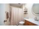 Clean bathroom with shower/tub combo, vanity, and linen storage at 10742 W Cheryl Dr, Sun City, AZ 85351