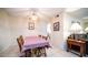 Charming dining area with a checkered tablecloth and wooden chairs at 10742 W Cheryl Dr, Sun City, AZ 85351