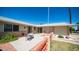 Small patio with table and chairs, next to a red fence at 10742 W Cheryl Dr, Sun City, AZ 85351