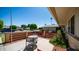 Small patio with table and chairs, red fence and street view at 10742 W Cheryl Dr, Sun City, AZ 85351