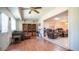 Sunroom with wood floors, a ceiling fan, and ample natural light at 10742 W Cheryl Dr, Sun City, AZ 85351