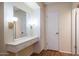 Neat vanity area with a large mirror and storage drawers at 10742 W Cheryl Dr, Sun City, AZ 85351