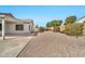 Landscaped backyard with gravel and covered patio at 10932 W Morten Ave, Glendale, AZ 85307