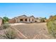 Spacious backyard with gravel and a covered patio at 10932 W Morten Ave, Glendale, AZ 85307