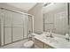 Clean bathroom with a shower/tub combo and vanity at 10932 W Morten Ave, Glendale, AZ 85307