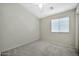 Simple bedroom with window and ceiling fan at 10932 W Morten Ave, Glendale, AZ 85307