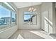 Bright breakfast nook with tile flooring and large windows at 10932 W Morten Ave, Glendale, AZ 85307