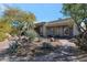 Landscaped backyard with desert plants, stone pathway, and patio at 12056 E Bella Vista Cir, Scottsdale, AZ 85259