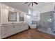 Modern bathroom with double vanity, large shower, and free-standing tub at 12056 E Bella Vista Cir, Scottsdale, AZ 85259