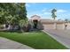 Beautiful two-story home with a three-car garage and manicured lawn at 12056 E Bella Vista Cir, Scottsdale, AZ 85259