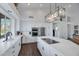 Updated kitchen featuring white cabinets, stainless steel appliances, and an island at 12056 E Bella Vista Cir, Scottsdale, AZ 85259