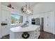 Modern kitchen with white cabinets, stainless steel appliances, and an island at 12056 E Bella Vista Cir, Scottsdale, AZ 85259