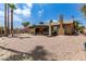 Spacious backyard with gravel, patio and a palm tree at 12059 S Paiute St, Phoenix, AZ 85044