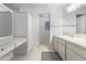 Clean bathroom with vanity, shower and separate toilet at 12059 S Paiute St, Phoenix, AZ 85044