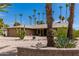 Single-story home with desert landscaping and a two-car garage at 12059 S Paiute St, Phoenix, AZ 85044