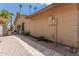 Landscaped yard with a side walkway and gated entrance at 12059 S Paiute St, Phoenix, AZ 85044