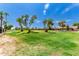 Landscaped greenbelt with mature trees and grass at 12059 S Paiute St, Phoenix, AZ 85044