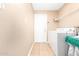 Bright laundry room, washer, dryer, and storage shelves at 12059 S Paiute St, Phoenix, AZ 85044