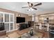 Living area with open concept kitchen and hardwood floors at 12059 S Paiute St, Phoenix, AZ 85044