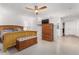 Main bedroom with wood furniture, tile floors, and a ceiling fan at 12059 S Paiute St, Phoenix, AZ 85044