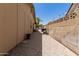 Gravel side yard with gated access at 12059 S Paiute St, Phoenix, AZ 85044