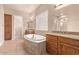 Bathroom boasts a large bathtub and double vanity at 12061 W Miner Trl, Peoria, AZ 85383