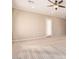 Large bedroom with door access and ceiling fan at 12061 W Miner Trl, Peoria, AZ 85383