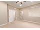 Well-lit bedroom with neutral walls and carpet at 12061 W Miner Trl, Peoria, AZ 85383