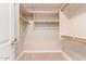 Walk-in closet with shelves and hanging rods at 12061 W Miner Trl, Peoria, AZ 85383