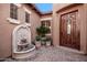 Front courtyard with fountain and brick pavers at 12061 W Miner Trl, Peoria, AZ 85383