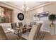 Formal dining room with glass table and chandelier at 12061 W Miner Trl, Peoria, AZ 85383