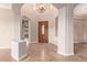 Elegant entryway with tiled floors and arched details at 12061 W Miner Trl, Peoria, AZ 85383