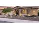 Stunning curb appeal with stone accents and well-manicured landscaping at 12061 W Miner Trl, Peoria, AZ 85383