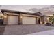 Two-story home with three-car garage and attractive landscaping at 12061 W Miner Trl, Peoria, AZ 85383