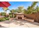 Outdoor fireplace and seating area perfect for entertaining at 12061 W Miner Trl, Peoria, AZ 85383