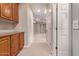 Hallway with built-in wooden cabinets and access to other rooms at 12061 W Miner Trl, Peoria, AZ 85383