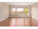 Bright living room with hardwood floors and large windows at 12061 W Miner Trl, Peoria, AZ 85383