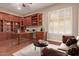 Home office with built-in cabinetry and seating area at 12061 W Miner Trl, Peoria, AZ 85383