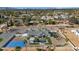 Aerial view of house, pool, and backyard with surrounding neighborhood at 12075 N 76Th Ct, Scottsdale, AZ 85260