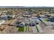 Aerial view of a modern home with a pool and landscaped yard, in a residential neighborhood at 12075 N 76Th Ct, Scottsdale, AZ 85260