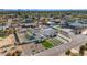 Aerial view of a modern home with pool and landscaped yard, in a desert setting at 12075 N 76Th Ct, Scottsdale, AZ 85260