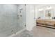 Modern bathroom with double vanity, walk-in shower, and tile floors at 12075 N 76Th Ct, Scottsdale, AZ 85260