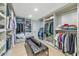 Large walk-in closet with ample hanging and shelf space at 12075 N 76Th Ct, Scottsdale, AZ 85260