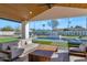 Relaxing patio with outdoor seating and a view of the pool at 12075 N 76Th Ct, Scottsdale, AZ 85260