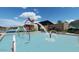 Community pool with water features and a large deck area at 12219 E Verbina Ln, Florence, AZ 85132