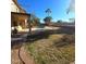 Relaxing backyard oasis featuring a sparkling pool and lush green grass at 12419 W Monte Vista Rd, Avondale, AZ 85392